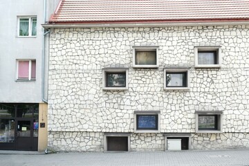 The facade of the building is made of a local variety of limestone known as the pinchak or Pinchow stone. Pinczow, Ponidze, Poland