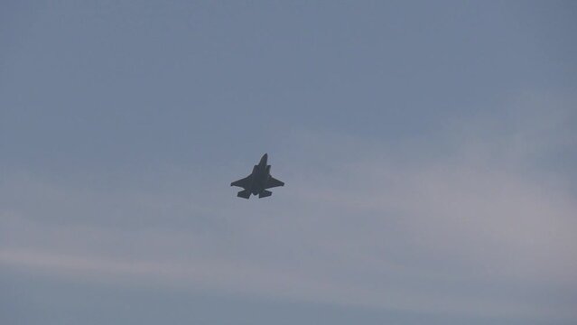 fighter jet makes low pass on sunny day