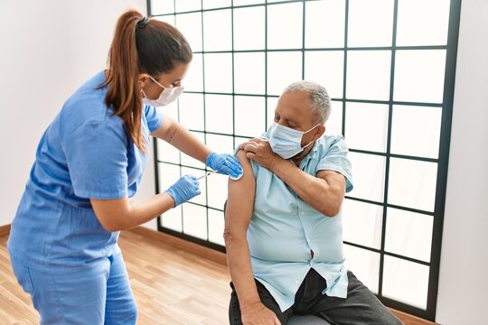 Senior Man With Safety Mas Getting Vaccinated With Covid 19 Immunity Vaccine, Nurse Injecting Prevention Vaccine