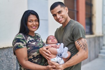 Hispanic family smiling confident hugging each other at street