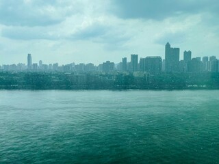 Rainy City Skyline with River