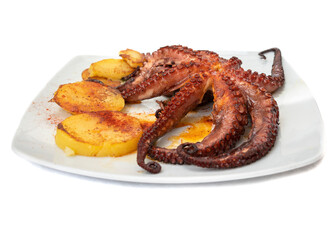 Grilled octopus dish with roasted potatoes. Spanish food concept.