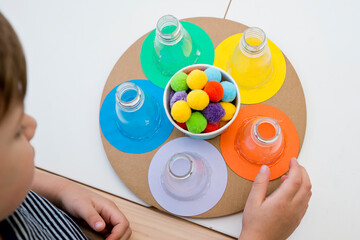 Put in correct color pom poms. Colorful ball sorting game for Kids. 5 minute crafts. DIY children...