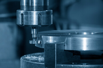 The NC milling machine T-slot cutting the metal parts.