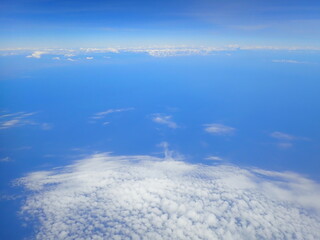 beautiful view over the cloud and blue sky from air plane window	