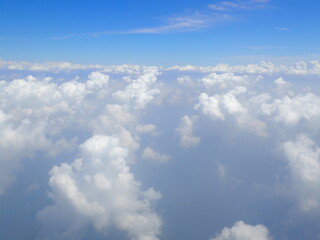 beautiful view over the cloud and blue sky from air plane window