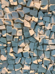 White granite. Several stones. Stone wall.