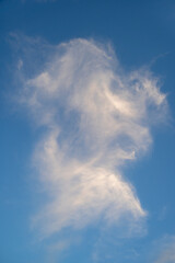 Fototapeta na wymiar White cirrus clouds in blue sky 