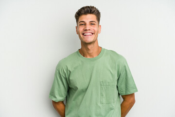 Young caucasian man isolated on white background happy, smiling and cheerful.