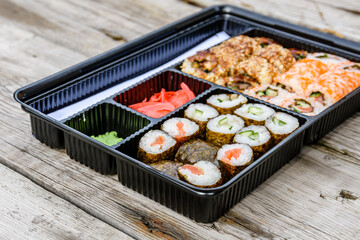 Set of the different sushi on wooden table