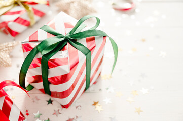 Christmas background with gift boxes and Christmas decorations on white, copy space