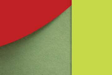 Textured and plain red yellow green sheet papers forming a curve and vertical blank rectangle for creative cover designing