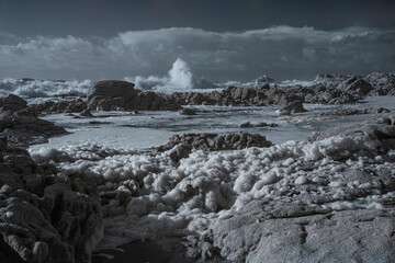 Infrared seascape with foam in the foreground