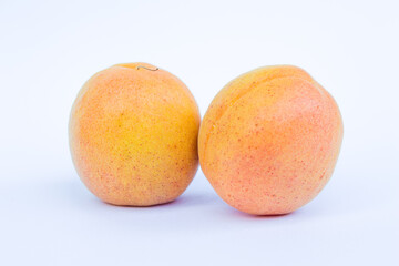 Apricot fruits isolated on white background.