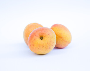 Apricot fruits isolated on white background.