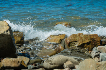 Sea Waves Makes White Foam And Crashing On Rock Seashore