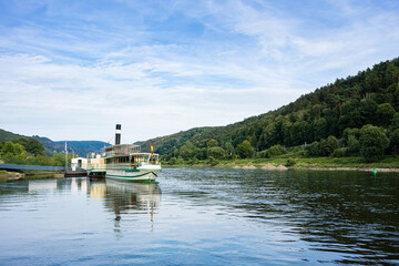 Fototapeta na wymiar A steamboat on the banks of the Elbe in Saxon Switzerland.