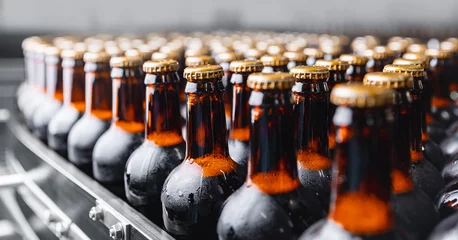 Keuken spatwand met foto Brown glass beer drink alcohol bottles, brewery conveyor, modern production line © Parilov