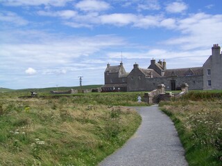 Fototapeta na wymiar Countryside and the famous Skaill House, a guest house and museum, Orkney Mainland, Orkney Islands, Scotland, United Kingdom