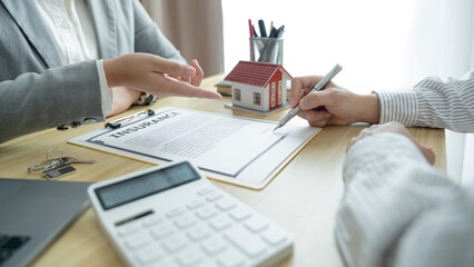 Home loan insurance. .Real estate broker and client  sign contract insurance agreement document. Business meeting concept