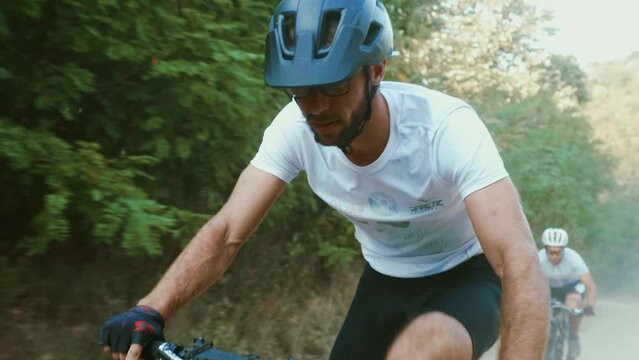 Mtb bike race on a dirt road on a mountain.