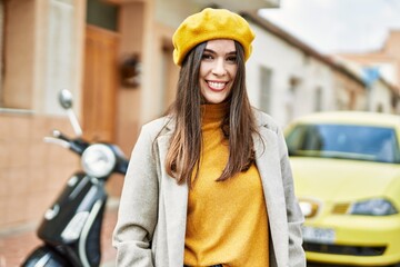 Young hispanic girl smiling happy standing at the city.