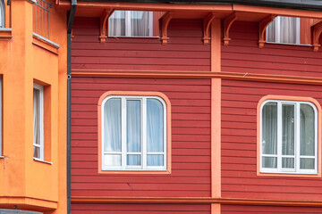 Obraz na płótnie Canvas Part of red-orange colorful building, exterior detail