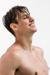 wet and cheerful man with athletic body and perfect skin isolated on white.