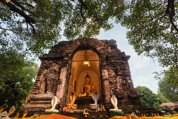 Thai Buddha statue with cobra snake statue guardians