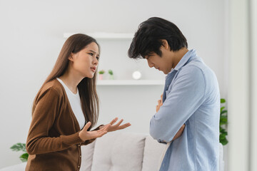 Family problems, Asian couple quarrel together at home. woman angry on man and man feel annoy.