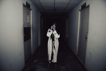 Portrait of asian woman make up ghost,Scary horror scene for background,Halloween festival...