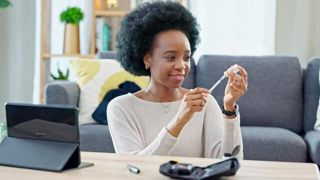 Woman with syringe preparing an insulin injection at home with an online tutorial. One girl injecting self with medicine treatment to treat chronic illnesses type 1 2 diabetes, high blood or glycemia