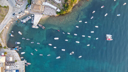 Aerial drone top down photo of sail boats and yachts anchored in traditional fishing village of...