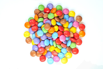 Background pile of multicolor chocolate candy top view