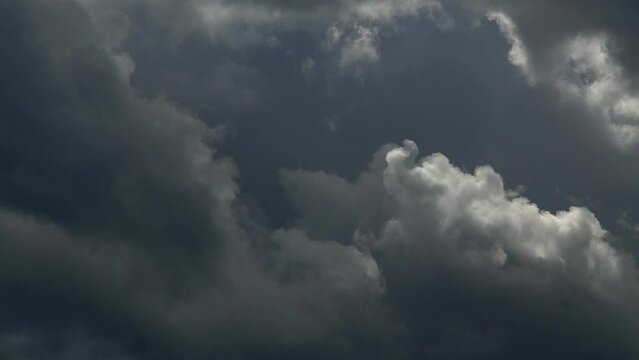 Dark storm clouds reveal a silver lining as they move past in this time lapse video.