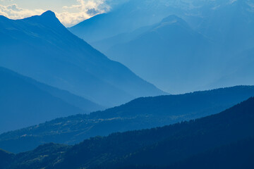 Panorama of mountains on the sunset.  Beautiful blue mountains and hills.