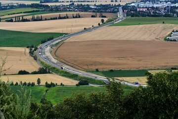 View from the ruins of the Stary Jicin castle on the road around Novy Jicin. Moravia. Czechia.