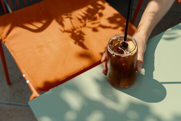 Still life shot of espresso tonic on summer terrace