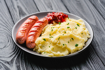 fresh tasty mashed potatoes on a black wooden rustic background