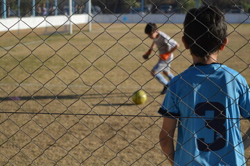 children playing soccer in the open air