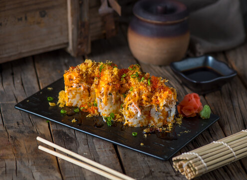 Miku maki served in a dish isolated on wooden background side view