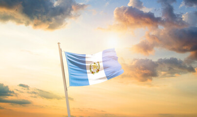 Guatemala national flag cloth fabric waving on the sky - Image