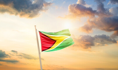 Guyana national flag cloth fabric waving on the sky - Image