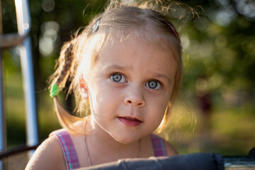 Baby girl plays in nature