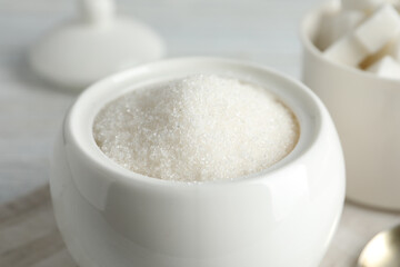 Ceramic bowl with white sugar, closeup view