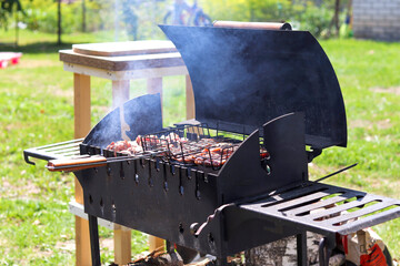 Meat kebab is grilled on charcoal. Barbecue in nature, cooking meat on the grill