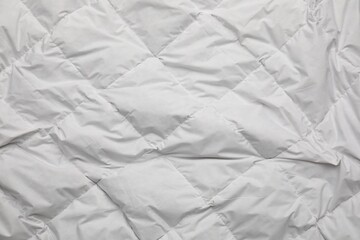 Obraz premium Soft crumpled blanket as background, top view