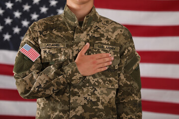 Male soldier and American flag on background, closeup. Military service