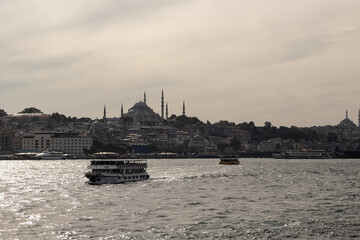 View of vruise tour boats on Golden Horn part of Bosphorus in Istanbul. Historical old town called Eminonu is in the background. Beautiful scene. - 519211229