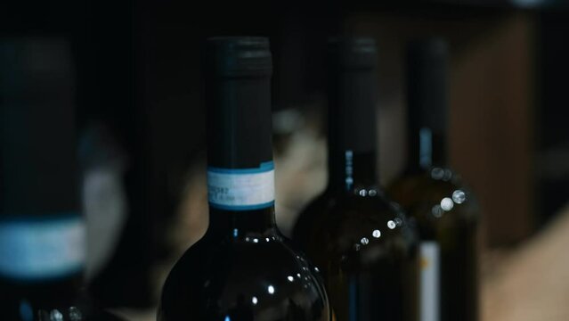 Red wine bottles in the wine store.